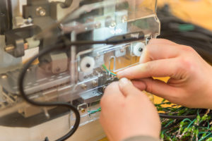Alta customized equipment that allows them to create customized solutions. An employee is shown working on the equipment