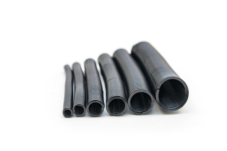 Side view of multiple sizes of black sleeving